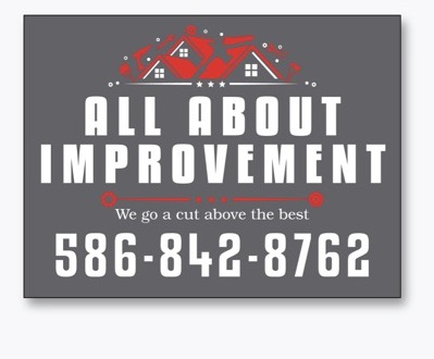 Charcoal yard magnet with red rooflines, white All About Improvement type, and the company phone number.